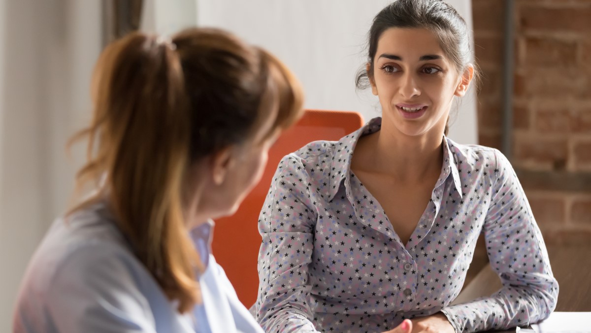 Manager providing feedback to a colleague