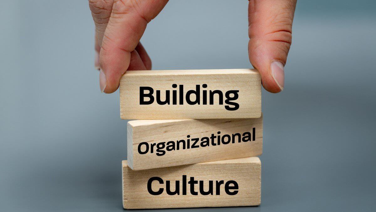Picture depicting the building blocks behind company culture, improved through workplace surveys